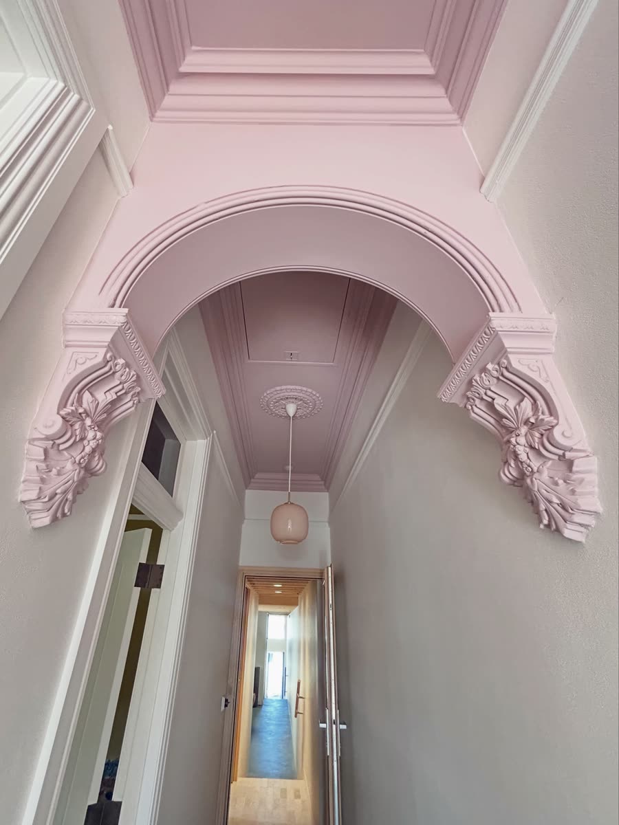 Arched hallway with ornate cornice
